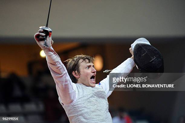 Russia's Alexey Cheremisinov celebrates after winning against Italy's Simone Vanni during the Men's International Paris' Challenge Epee competition,...