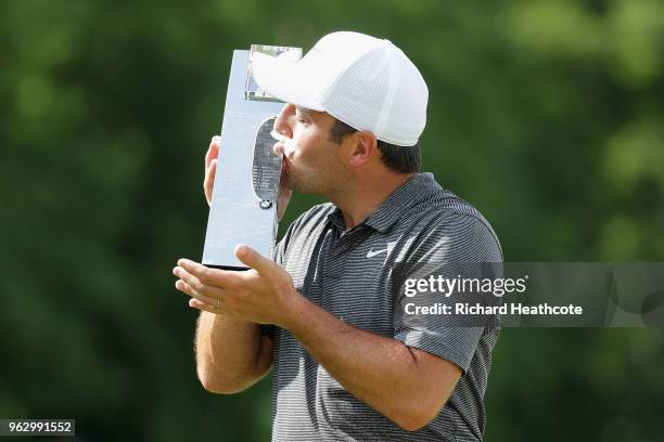 Francesco Molinari of Italy kisses the trophy after winning the BMW PGA Championship at Wentworth on May 27, 2018 in Virginia Water, England.