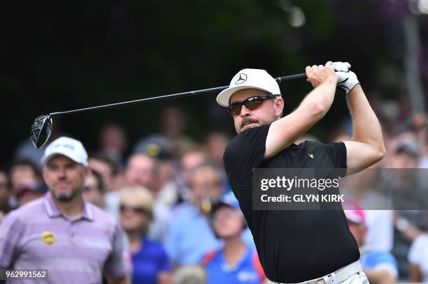 Finland's Mikko Korhonen tees off the seventeenth hole on day four of the golf PGA Championship at Wentworth Golf Club in Surrey, south west of...