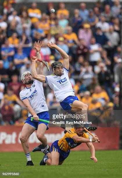Clare , Ireland - 27 May 2018; Shane McNulty, left, and Jamie Barron of Waterford in action against David Reidy of Clare during the Munster GAA...