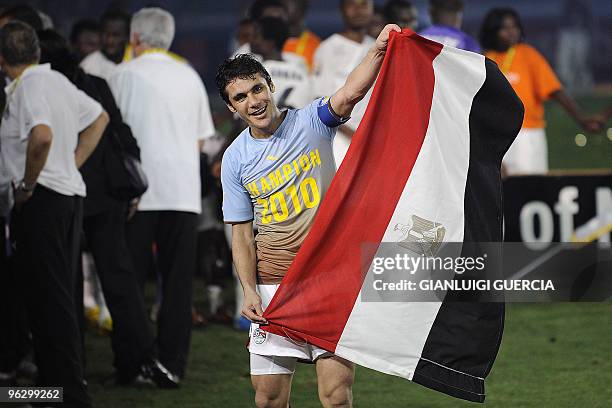 Kamel Ahmed Hassan Captain of Egypt waves an Egyptian flag before receiving the African Cup of Nations trophy after winning their final match of the...