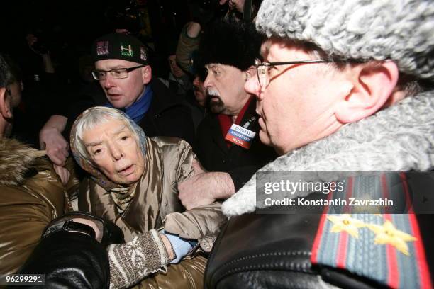 Police officers try to detain Russian human rights activist Lyudmila Alexeyeva during an unauthorized anti-Kremlin protest January 31, 2010 in...