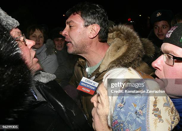 Former First Deputy Prime Minister Boris Nemtsov , leader of the opposition group Solidarity, argues with police officers as they detain him during...