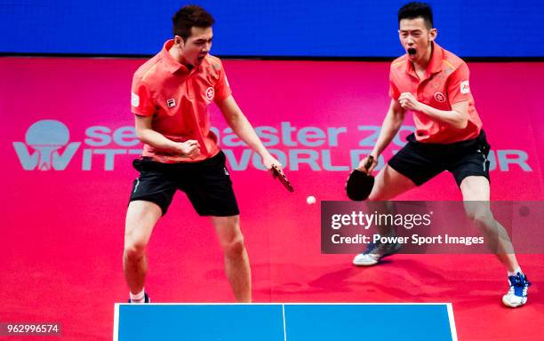 Ho Kwan Kit and Wong Chun Ting of Hong Kong competes against Masataka Morizono and Yuya Oshima of Japan during the men's doubles - final match of...