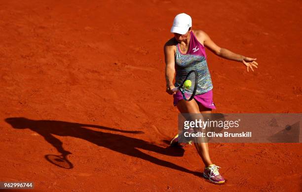 Yulia Putintseva of Kazhakstan plays a backhand during her singles first round match against Johanna Konta of Great Britain during day one of the...