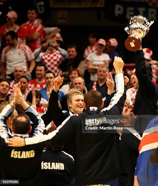 The team of Iceland celebrate their 3rd place after the Men's Handball European final match between France and Croatia at the Stadthalle on January...