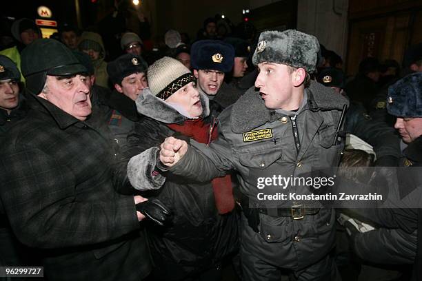 Opposition activists push a police officer during an unauthorized anti-Kremlin protest January 31, 2010 in downtown Moscow, Russia. Several hundred...