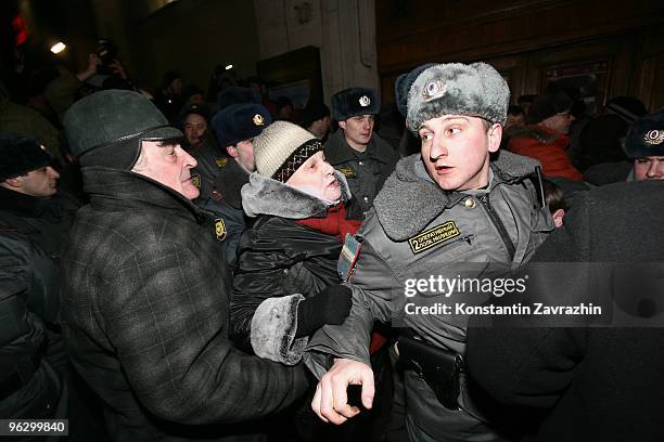 Opposition activists push a police officer during an unauthorized anti-Kremlin protest January 31, 2010 in downtown Moscow, Russia. Several hundred...