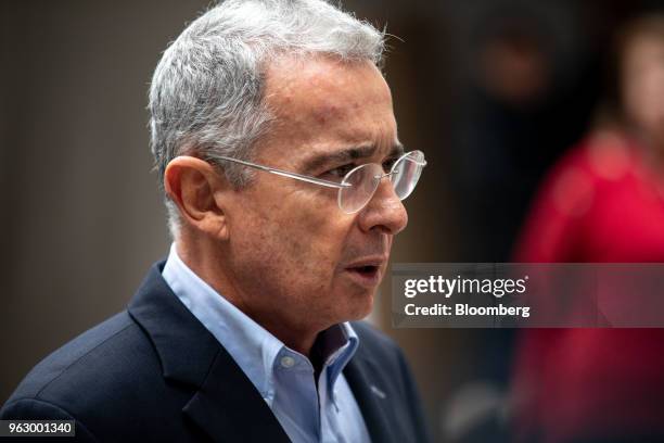 Alvaro Uribe, former president of Colombia, speaks ahead of casting his ballot at the National Congress during presidential elections in Bogota,...