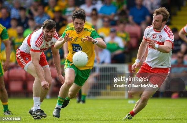 Derry , Ireland - 27 May 2018; Ryan McHugh of Donegal in action against Mark Lynch and Padraig Cassidy of Derry during the Ulster GAA Football Senior...
