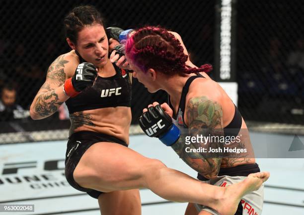 Gina Mazany punches Lina Lansberg of Sweden in their women's bantamweight bout during the UFC Fight Night event at ECHO Arena on May 27, 2018 in...