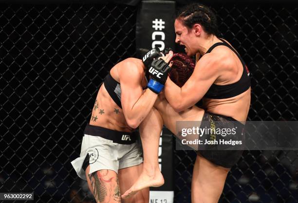 Lina Lansberg of Sweden knees Gina Mazany in their women's bantamweight bout during the UFC Fight Night event at ECHO Arena on May 27, 2018 in...