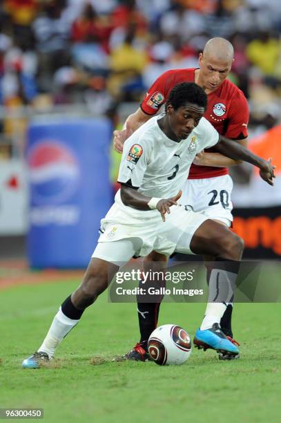 Asamoah Gyan of Ghana and Wael Gomaa of Egypt during the Africa Cup of Nations final match between Ghana and Egypt from November 11 Stadium on...