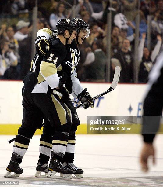 Evgeni Malkin and Jordan Staal of the Pittsburgh Penguins celebrate their shootout victory against the Detroit Red Wings at Mellon Arena on January...