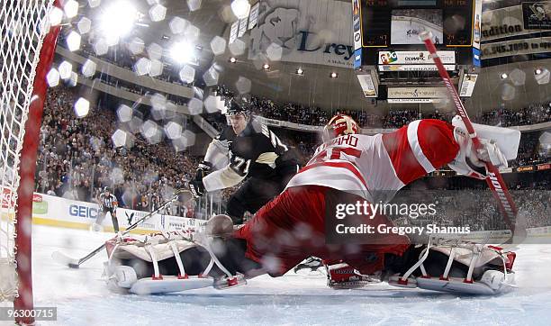 Evgeni Malkin of the Pittsburgh Penguins scores the game winning shootout goal against Jimmy Howard of the Detroit Red Wings on January 31, 2010 at...