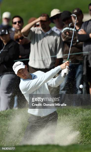 Ben Crane hits out of the bunker on the sixth hole during the final round of the 2010 Farmers Insurance Open on January 31, 2010 at Torrey Pines Golf...