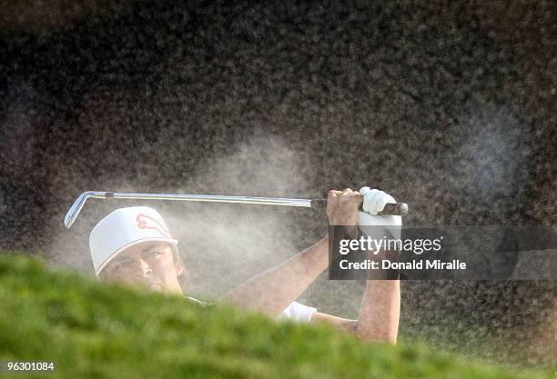 Ricky Fowler hits out of the bunker on the first fairway during the final round of the 2010 Farmers Insurance Open on January 31, 2010 at Torrey...