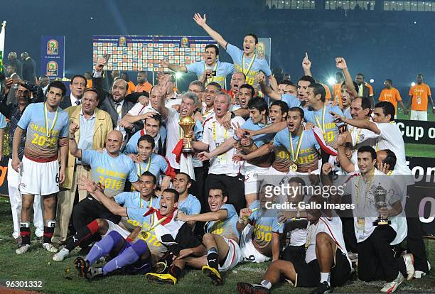 Egyptian players and coaching staff celebrate winning the Africa Cup of Nations final match between Ghana and Egypt from Universitaria Stadium on...