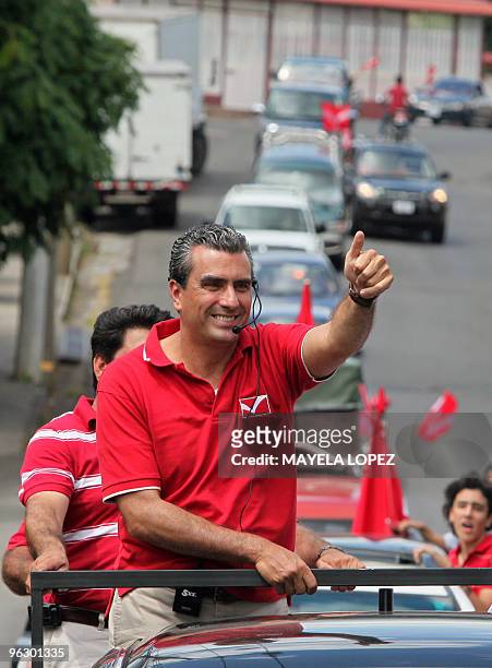 Opposition Libertarian Movement presidential candidate Otto Guevara, gives the thumb up on January 31 in Poas de Alajuela, 30 kilometers northwest of...