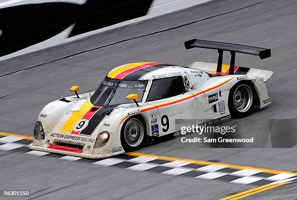 The Action Express Racing Porsche driven by Terry Borcheller, Joao Barbosa, Mike Rockenfeller, and Ryan Dalziel crosses the finish line to win the...