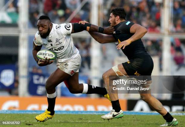 Tendai Mtawarira of Sharks hands off Javier Ortega Desio of Jaguares during a match between Jaguares and Sharks as part of Super Rugby 2018 at Jose...