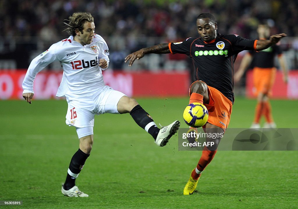 Sevilla's midfielder Diego Capel (L) vie