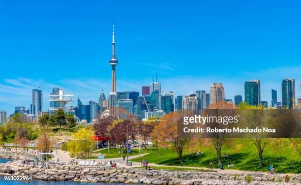 toronto canada: urban skyline including the cn tower during the daytime - ontario canada stock pictures, royalty-free photos & images