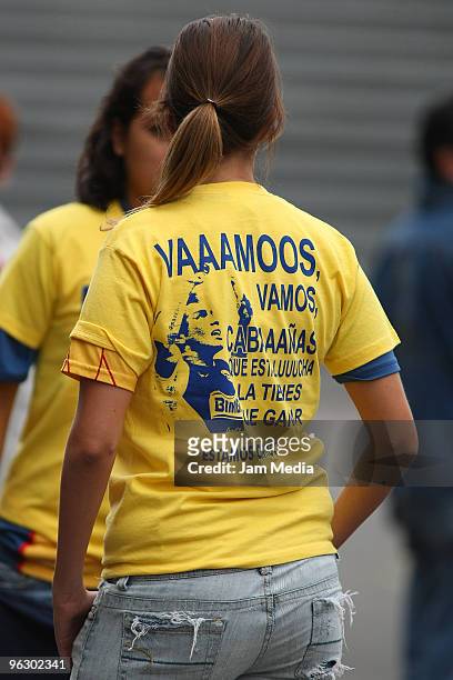 Fan of America shows her support for the team?s striker Salvador Cabanas as she waits for the start of a Mexican championship Bicentenario 2010 match...