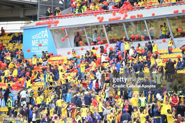Fans of Colombia cheer their team during a training session open to the public at Nemesio Camacho Stadium. As part of the preparation for FIFA World...