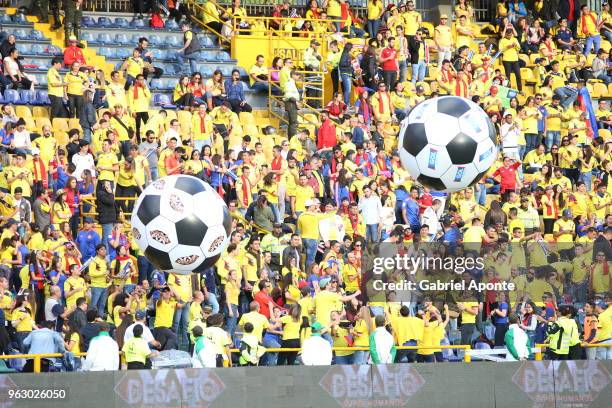 Fans of Colombia cheer their team during a training session open to the public at Nemesio Camacho Stadium. As part of the preparation for FIFA World...