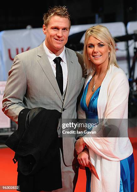 South African rugby international Jean de Villiers and guest attend the UK premiere of Invictus at the Odeon West End on January 31, 2010 in London,...