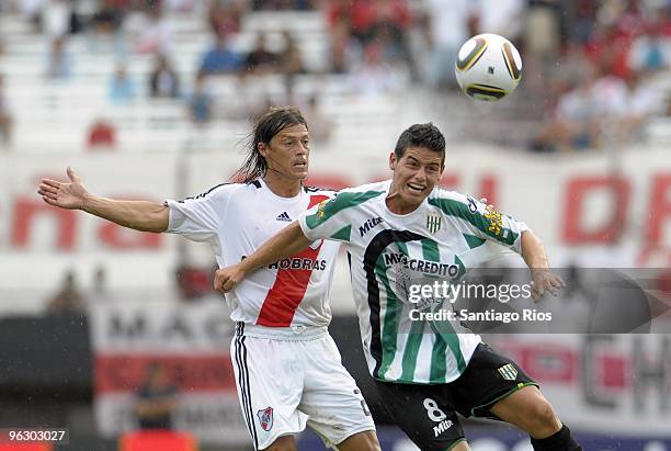 Matias Almeyda of River Plate battles for the ball with Banfield´s James Rodriguez during an Argentine championship Primera A soccer match at the...