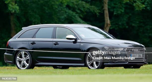 Prince William, Duke of Cambridge arrives, driving his Audi S6 car, to play in the Jerudong Trophy charity polo match at Cirencester Park Polo Club...