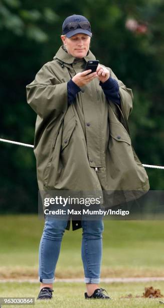 Zara Tindall watches her cousin Prince William, Duke of Cambridge play in the Jerudong Trophy charity polo match at Cirencester Park Polo Club on May...