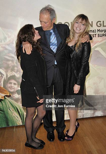 Director Clint Eastwood with his daughters Morgan and Francesca attend the "Invictus" film premiere at the Odeon West End on January 31, 2010 in...
