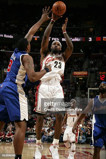 LeBron James of the Cleveland Cavaliers shoots over Brian Skinner of the Los Angeles Clippers on January 31, 2010 at The Quicken Loans Arena in...