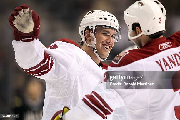 Defenseman Sami Lepisto of the Phoenix Coyotes celebrates a goal with Keith Yandle against the Dallas Stars in the first period at American Airlines...