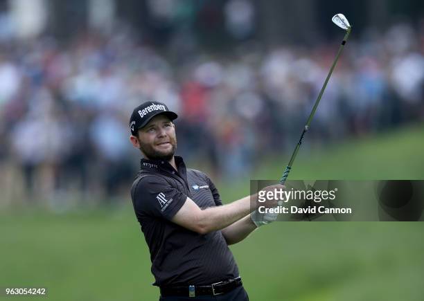 Branden Grace of South Africa plays his second shot on the par 4, 16th hole during the final round of the 2018 BMW PGA Championship on the West...