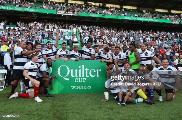 The Barbarian team celebrate victory with the trophy after the Quilter Cup match between England and Barbarians at Twickenham Stadium on May 27, 2018...