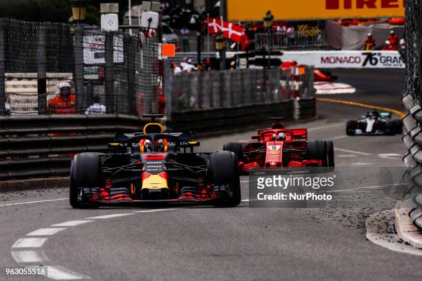 Daniel Ricciardo from Australia with Aston Martin Red Bull Tag Heuer RB14 in front of 05 Sebastian Vettel from Germany with Scuderia Ferrari SF71H...