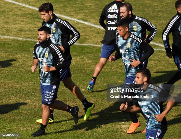 Sergio Aguero, Marcos Rojo and Gonzalo Higuaín run during a training session open to the public as part of the team preparation for FIFA World Cup...