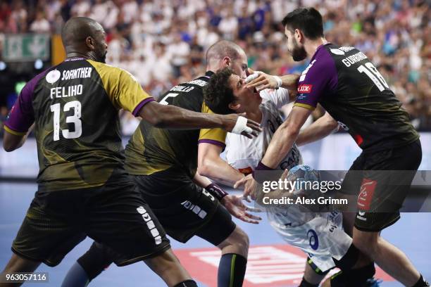 Diego Simonet of Montpellier is challenged by Rock Feliho, Romaric Guillo and Eduardo Gurbindo Martinez of Nantes during the EHF Champions League...