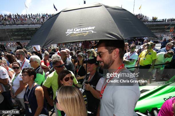 Danica Patrick, driver of the GoDaddy Chevrolet stands with Aaron Rodgers prior to the 102nd Running of the Indianapolis 500 at Indianapolis...