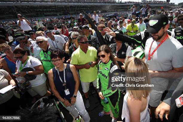 Danica Patrick, driver of the GoDaddy Chevrolet stands with Aaron Rodgers prior to the 102nd Running of the Indianapolis 500 at Indianapolis...