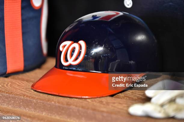 Detailed view of a Washington Nationals batting helmet in the dugout before the start of the game against the Miami Marlins at Marlins Park on May...