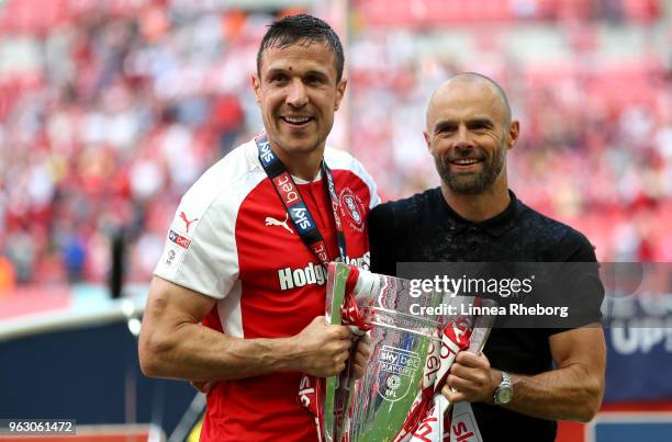 Richard Wood of Rotherham United and Paul Warne, Manager of Rotherham United celebrate victory with the trophy after the Sky Bet League One Play Off...