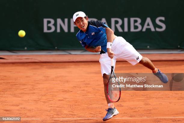 Yoshihito Nishioka of Japan serves during his mens singles first round match against Fernando Verdasco of Spain during day one of the 2018 French...
