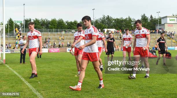 Derry , Ireland - 27 May 2018; A dejected Derry players leave the field after the Ulster GAA Football Senior Championship Quarter-Final match between...