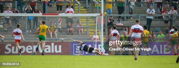 Derry , Ireland - 27 May 2018; Cian Mulligan of Donegal scoring his side's second goal past Ben McKinless of Derry during the Ulster GAA Football...