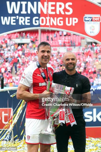 Rotherham captain Richard Wood and manager Paul Warne pose with the trophy during the Sky Bet League One Play Off Semi Final:Second Leg between...
